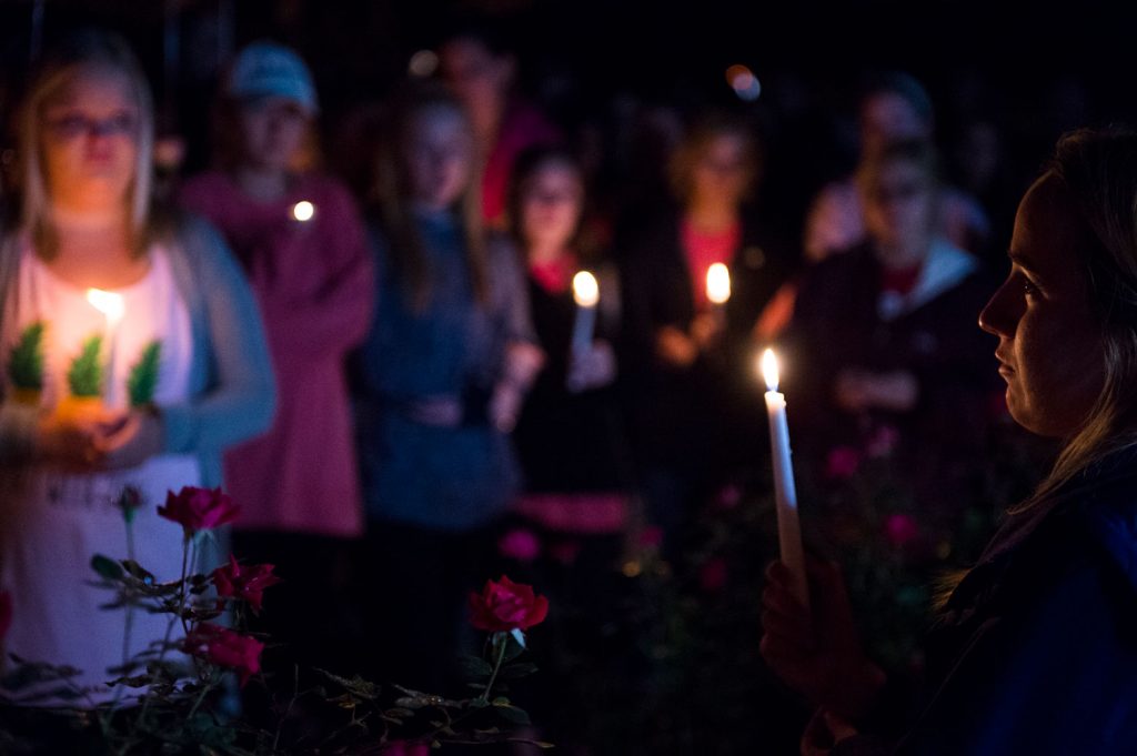 Mourners gather honor for Stephanie Campbell in front of the Alpha Gamma Delta house. Campbell died in a single car accident. (Talisman/Michael Noble Jr.)