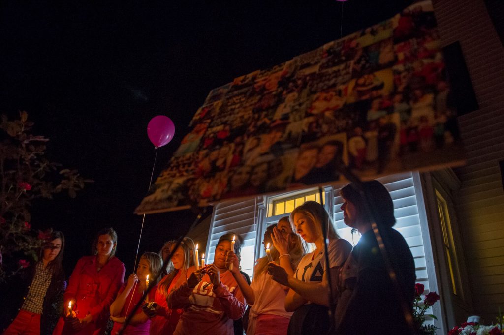 Alpha Gamma Delta alumni shares with hundreds during a vigil honor for Stephanie Campbell in front of the Alpha Gamma Delta house. Campbell died in a single car accident Grayson County. (Talisman/Michael Noble Jr.)