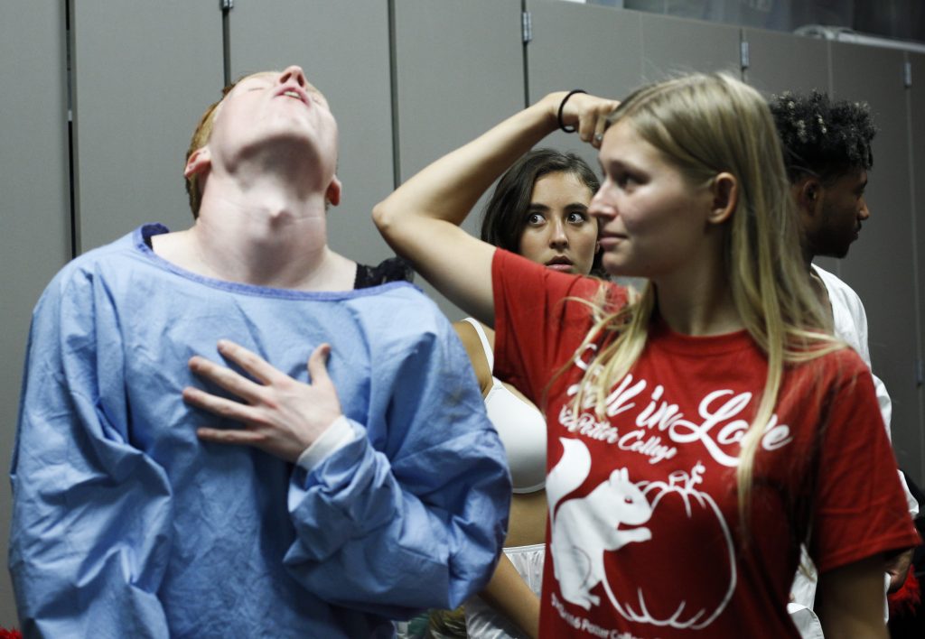 Sophia Nasato, Bowling Green sophomore rehearses with fellow cast members, Aaron Morrison, a Bowling Green junior, and Madeline Louise, a sophomore. The cast members met twice every week in order to prepare for the final performance of Rocky Horror Picture Show on Oct. 31. Photo by Mhari Shaw.