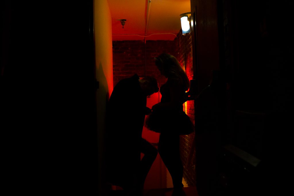 Morrison helps Felicia Thornsbury, a sophomore, with her costume backstage before the final performance on Monday Oct. 31. This was the second year for Morrison and Thornsbury to perform in the show. Photo by Mhari Shaw.