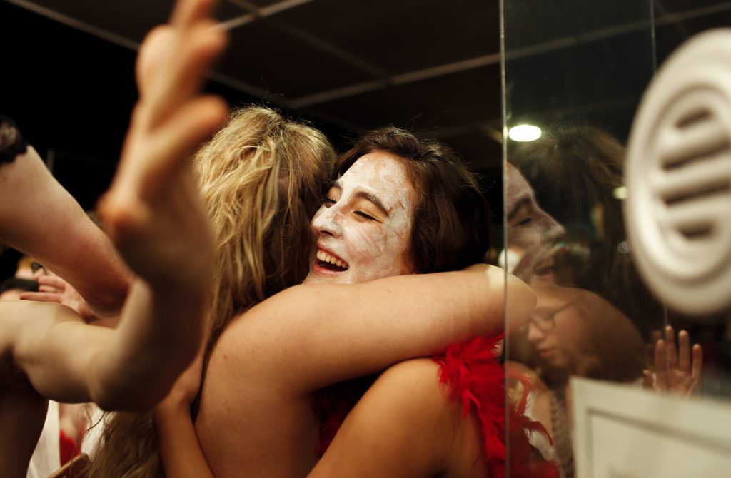 Nasato embraces friends after the show. Every year the auditions were held for cast members. "Its so much fun and it really takes you out of your comfort zone and I love that kind of stuff." Nasato said. Photo by Mhari Shaw.