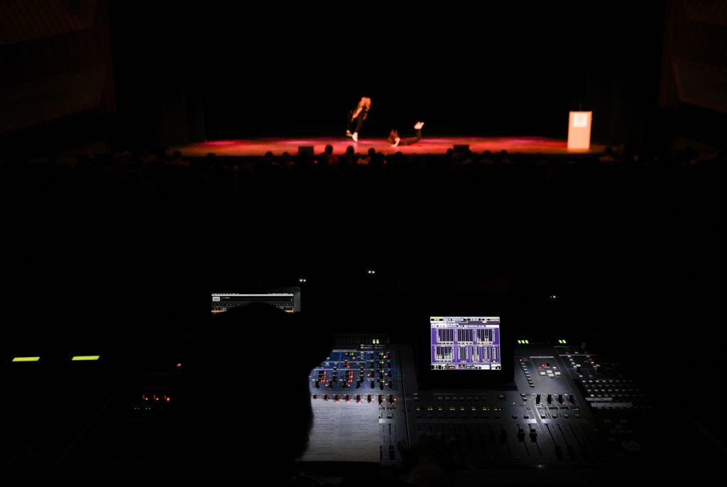 A member of the SKyPAC technical crew runs sound during Shenanigans. Each act consisted of several songs stitched together with lip-synced conversations and skits in between.