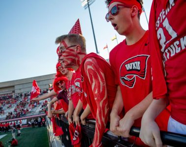 WKU Sophomore, Landon Patton, screams with his friends in the student section during the first game of the season against Sam Houston Bearkats at Houchens-Smith Stadium on Saturday, Aug. 23. (Photo by Kaitlyn Webb)