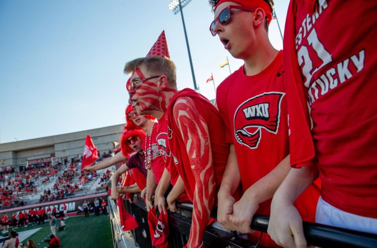 WKU Sophomore, Landon Patton, screams with his friends in the student section during the first game of the season against Sam Houston Bearkats at Houchens-Smith Stadium on Saturday, Aug. 23. (Photo by Kaitlyn Webb)