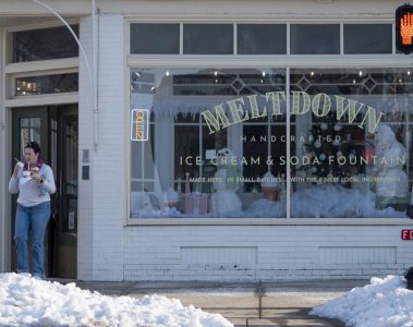 A customer leaves Meltdown Ice Cream & Soda Shop with three ice creams on Thursday, Jan. 29. (Photo by Brennan Campbell)