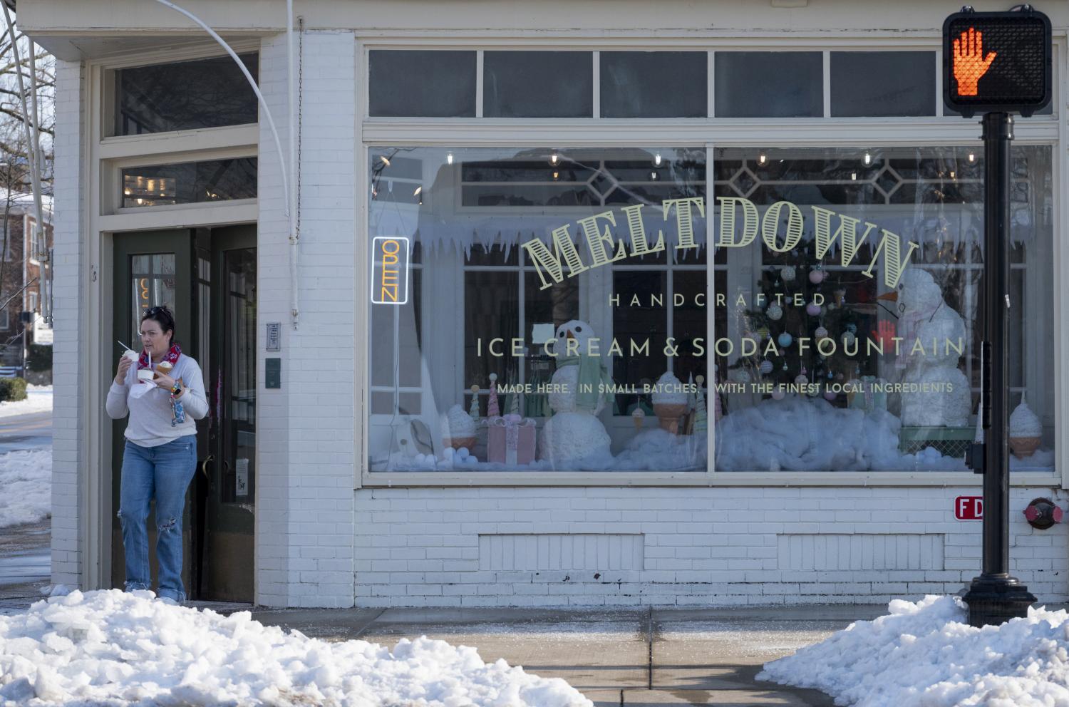 A customer leaves Meltdown Ice Cream & Soda Shop with three ice creams on Thursday, Jan. 29. (Photo by Brennan Campbell)